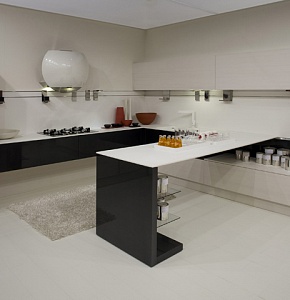 Кухня в стиле хай-тек. Строгие прямые линии черно-белых фасадов из пластика в сочетании с каменной столешницей реализовали эксклюзивный дизайн-проект современной кухни.